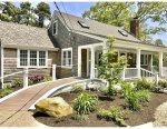 Front of the home with farmer`s porch & ramp access